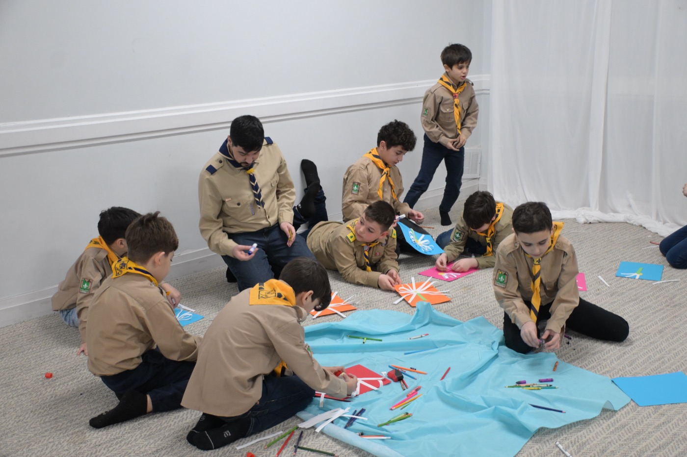 Scouts doing crafts during the weekly program