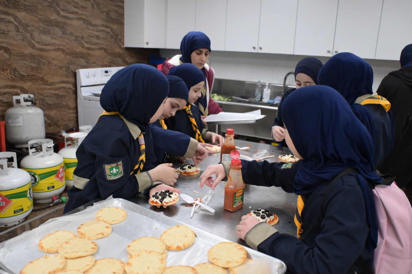 Scouts cooking together in the kitchen